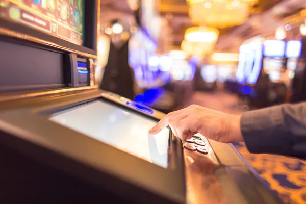 VM916 Mobile App — Your complete hub for casino and sports A man focused on his laptop with live stats in the background, highlighting the dedicated sports and gaming features of the VM916 mobile app.