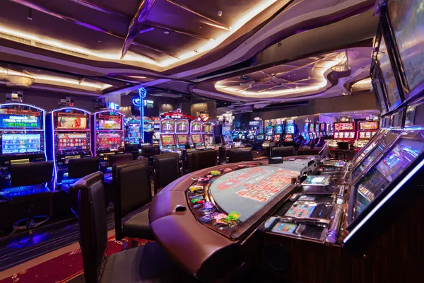 VM916 Live Games — Take part in high-energy casino action A glowing roulette wheel with cascading chips, symbolizing the engaging live and instant-win games available on VM916.