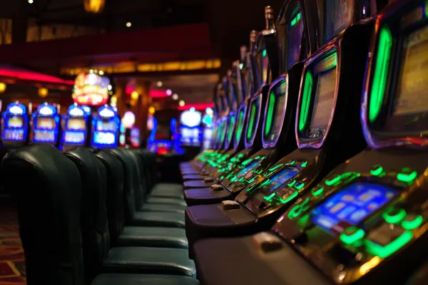 A woman in a luxurious green gown next to an ornate roulette wheel, capturing the upscale casino mood of VM916.