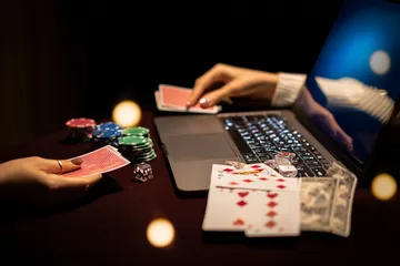 VM916 Mobile Casino — Play anytime, anywhere A player using their smartphone during a festive local event, representing VM916’s fully mobile-friendly casino.